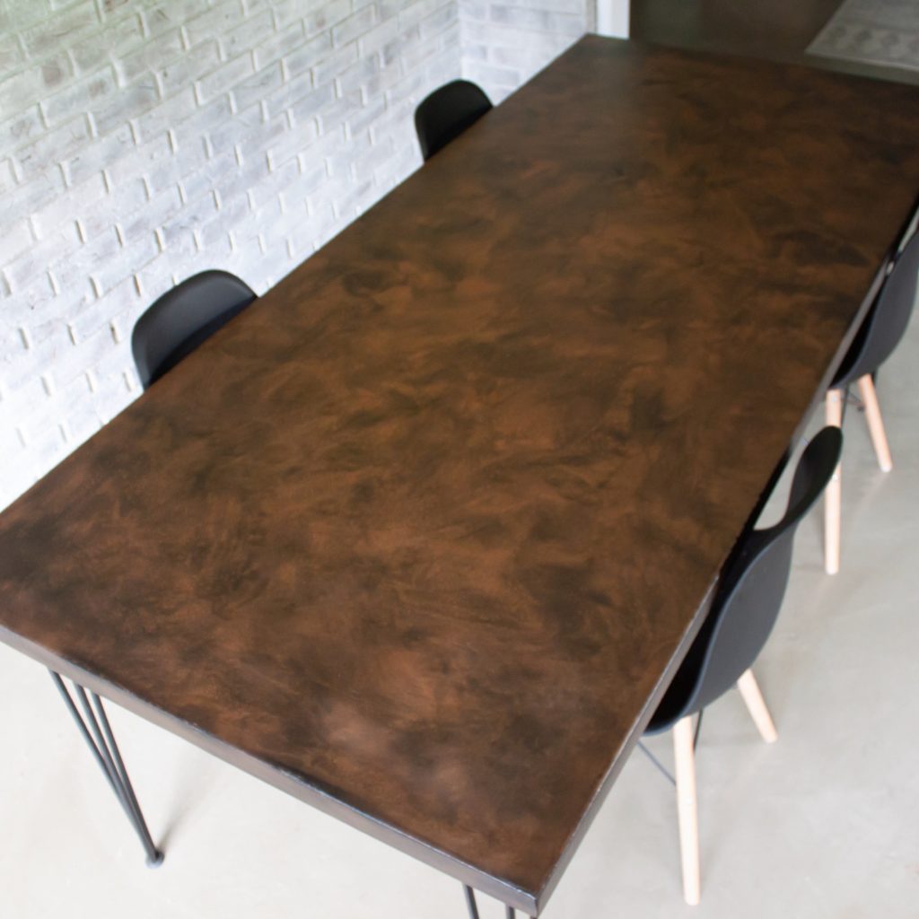 Brown and Black Metallic Dining Room Table